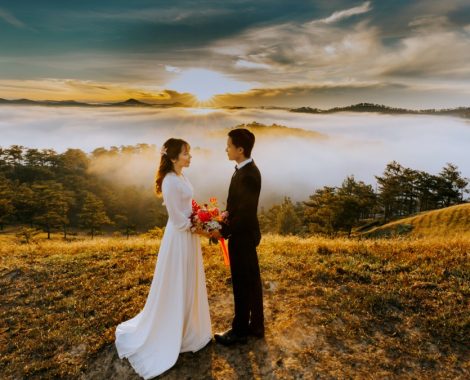 couple-standing-on-grass-field-while-looking-at-each-other-1603884